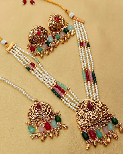 Premium Matt Gold Polish Necklace Set with Pearls & Multi-Stone Detailing With Earrings and Maang Tikka