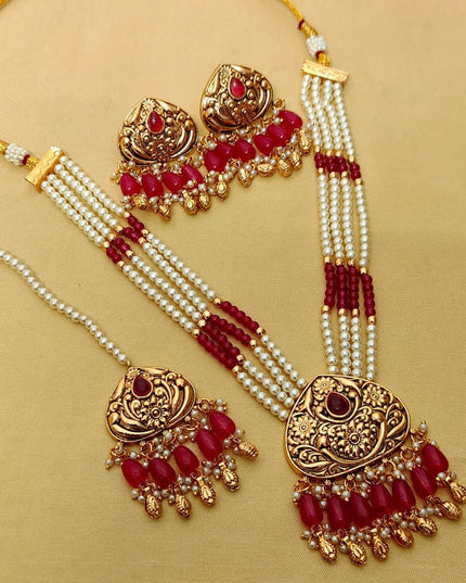 Premium Matt Gold Polish Necklace Set with Pearls & Multi-Stone Detailing With Earrings and Maang Tikka