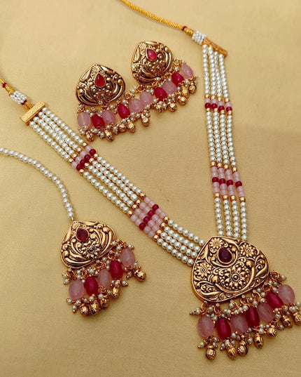 Premium Matt Gold Polish Necklace Set with Pearls & Multi-Stone Detailing With Earrings and Maang Tikka
