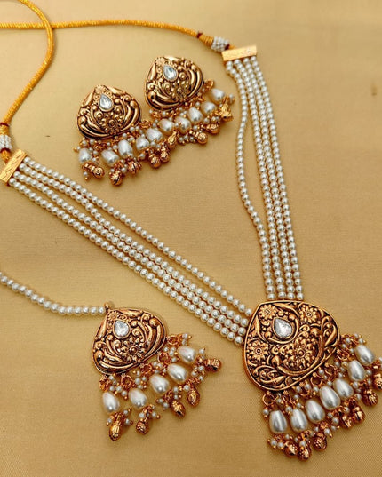 Premium Matt Gold Polish Necklace Set with Pearls & Multi-Stone Detailing With Earrings and Maang Tikka