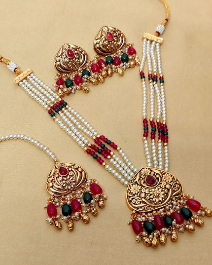 Premium Matt Gold Polish Necklace Set with Pearls & Multi-Stone Detailing With Earrings and Maang Tikka