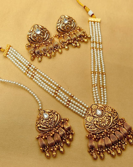 Premium Matt Gold Polish Necklace Set with Pearls & Multi-Stone Detailing With Earrings and Maang Tikka