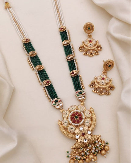 Designer Matt Gold Finish Necklace Set with Handcrafted Detailing and Statement Earrings